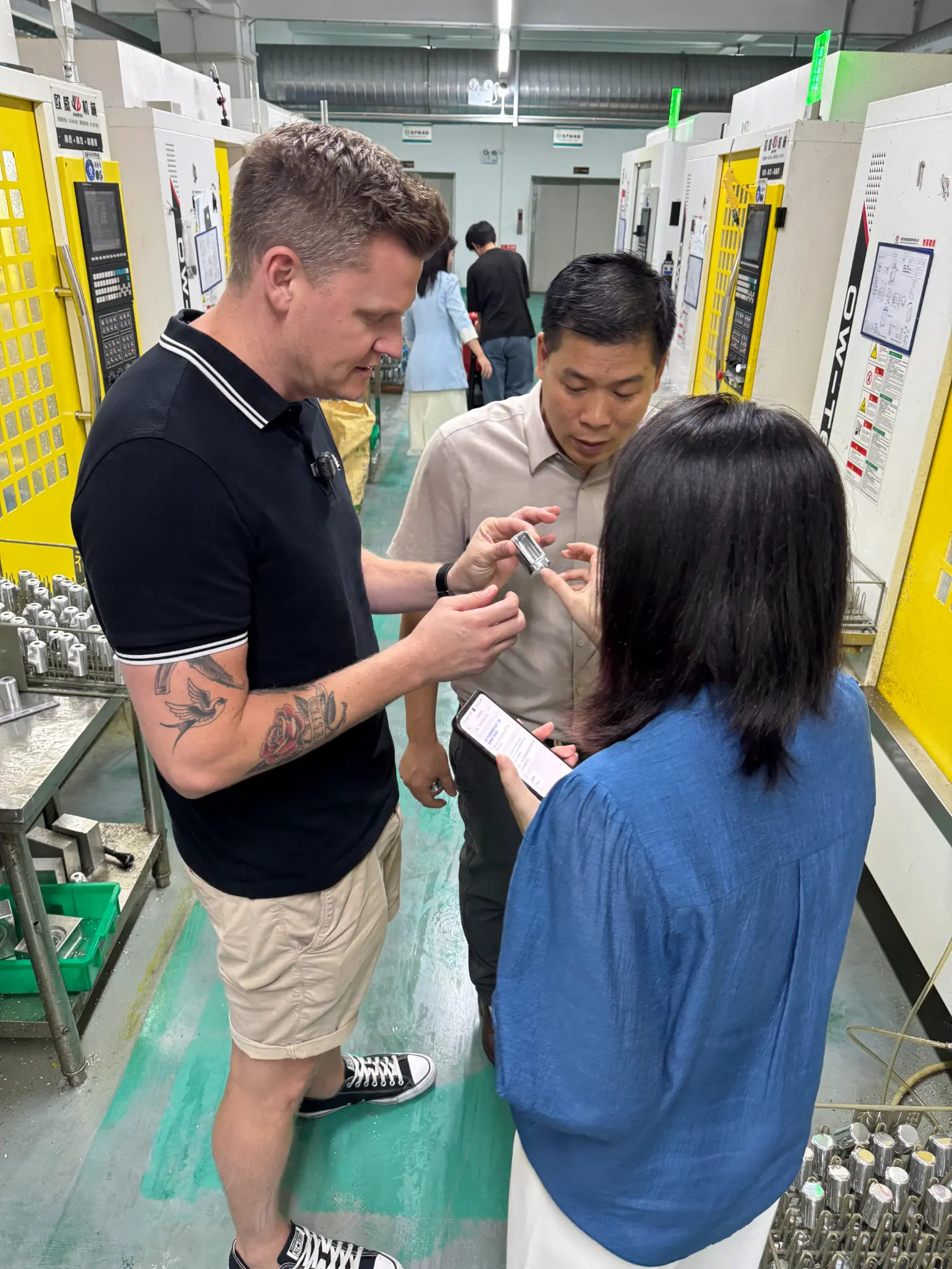 Lyden inspecting products on factory floor with supplier