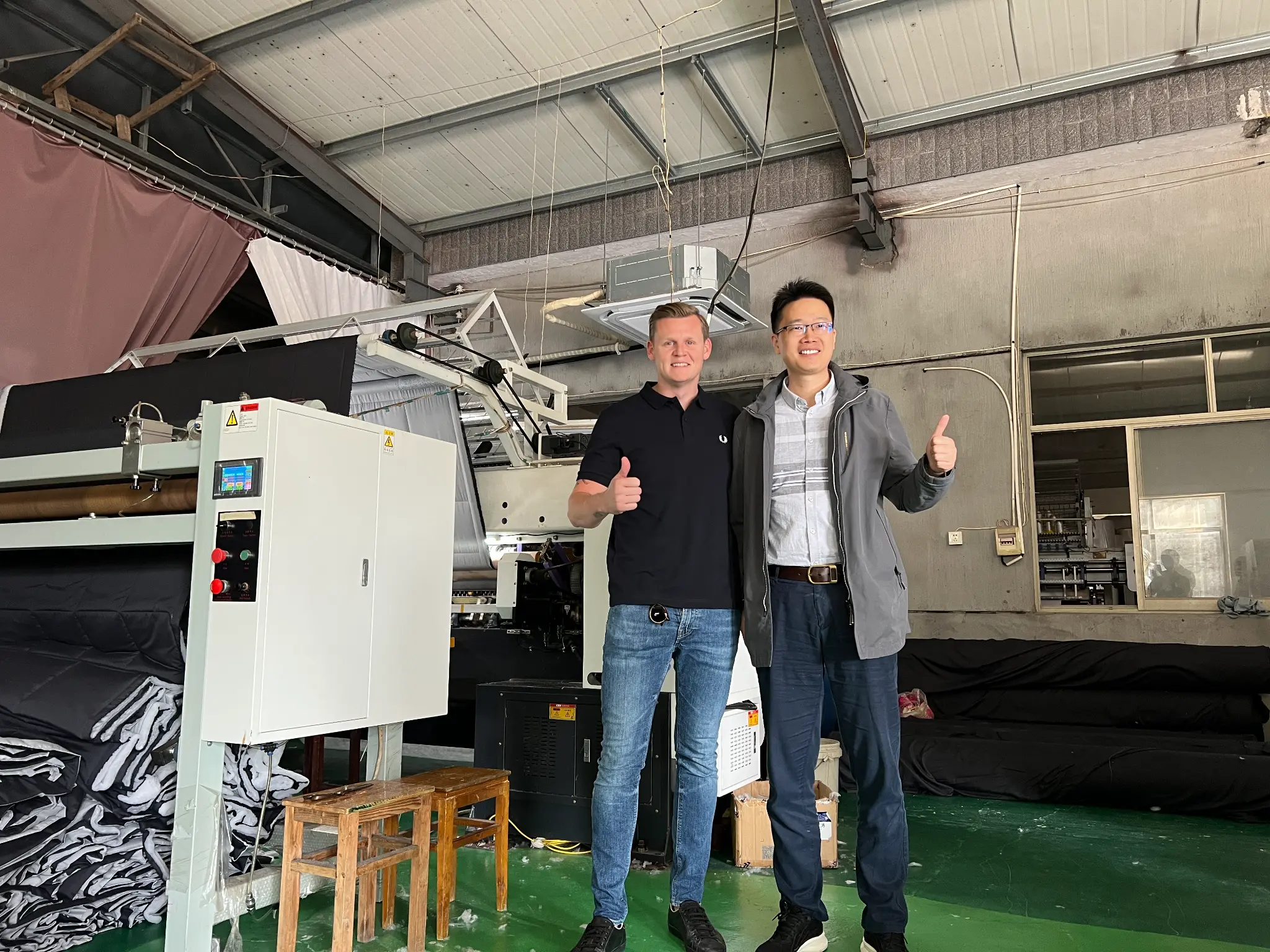 Lyden with supplier partner in factory