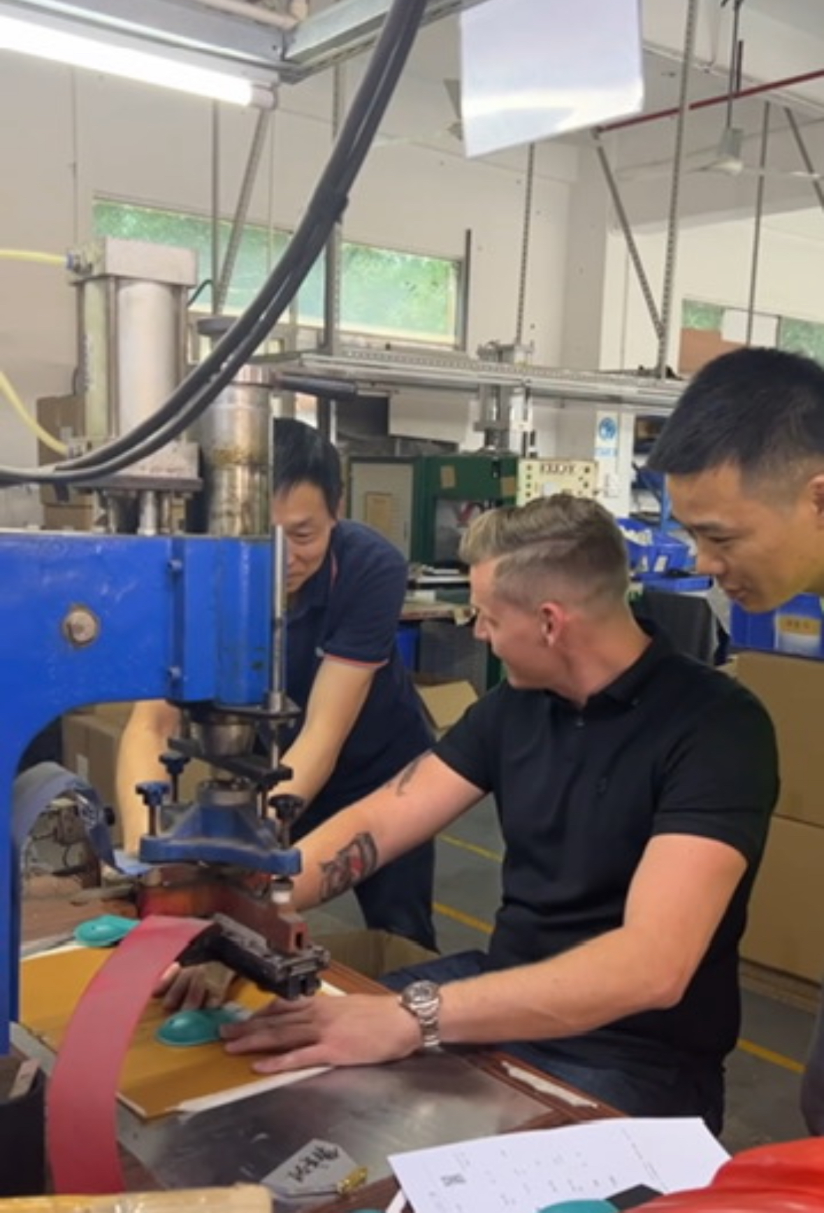 Lyden working alongside suppliers at machinery